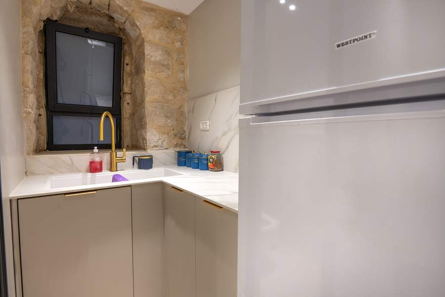Kitchen with marble counters