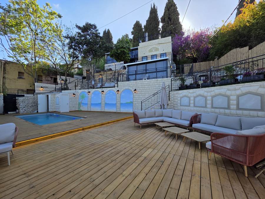 Wide view of pool and lounge seating together