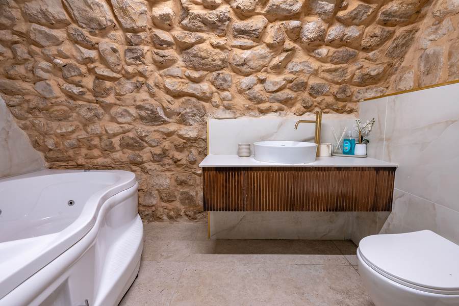Suite bathroom with jacuzzi tub and marble vanity